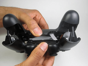Split apart the controller’s plastic cover